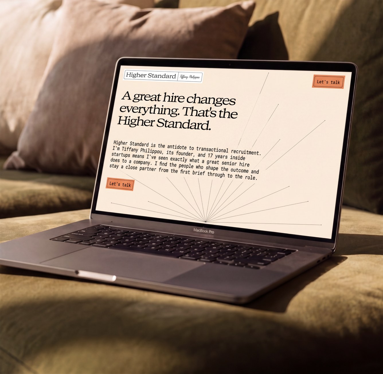 Higher Standard website on a laptop