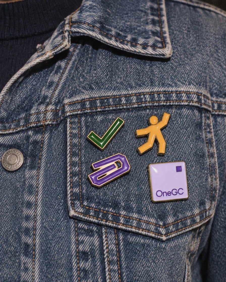 Photo: OneGC enamel pins on a denim jacket