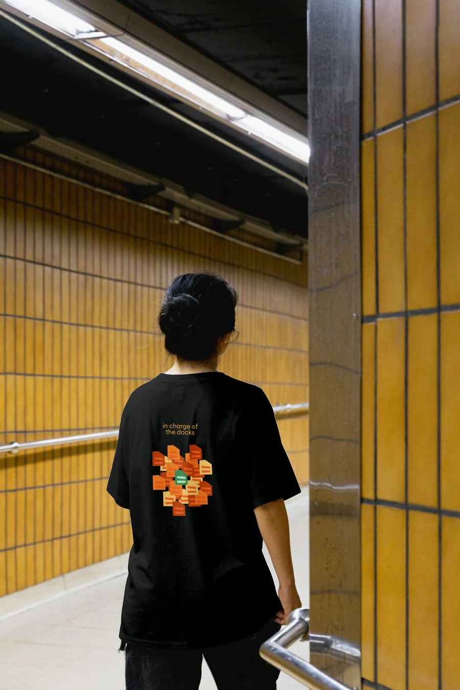 OneGC t-shirt in a subway corridor